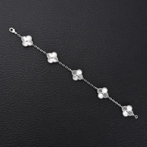 Van Cleef & Arpels Alhambra bracelet silver chain with four clover-shaped motifs in metal on black background