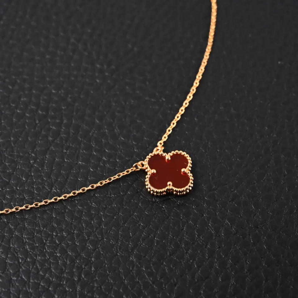 Van Cleef & Arpels Alhambra necklace red carnelian yellow gold chain accessory
