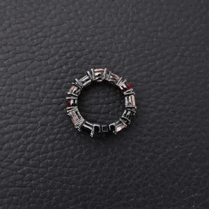Chrome Hearts ring silver with black and red gemstone accents circular band accessory