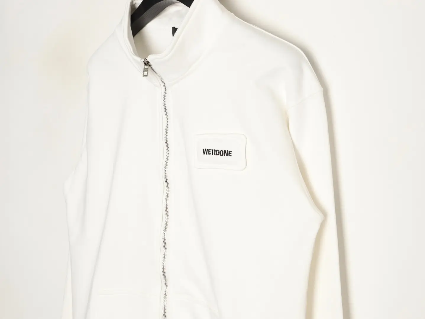 WE11DONE full-zip jacket white cotton with branded chest patch and silver zipper