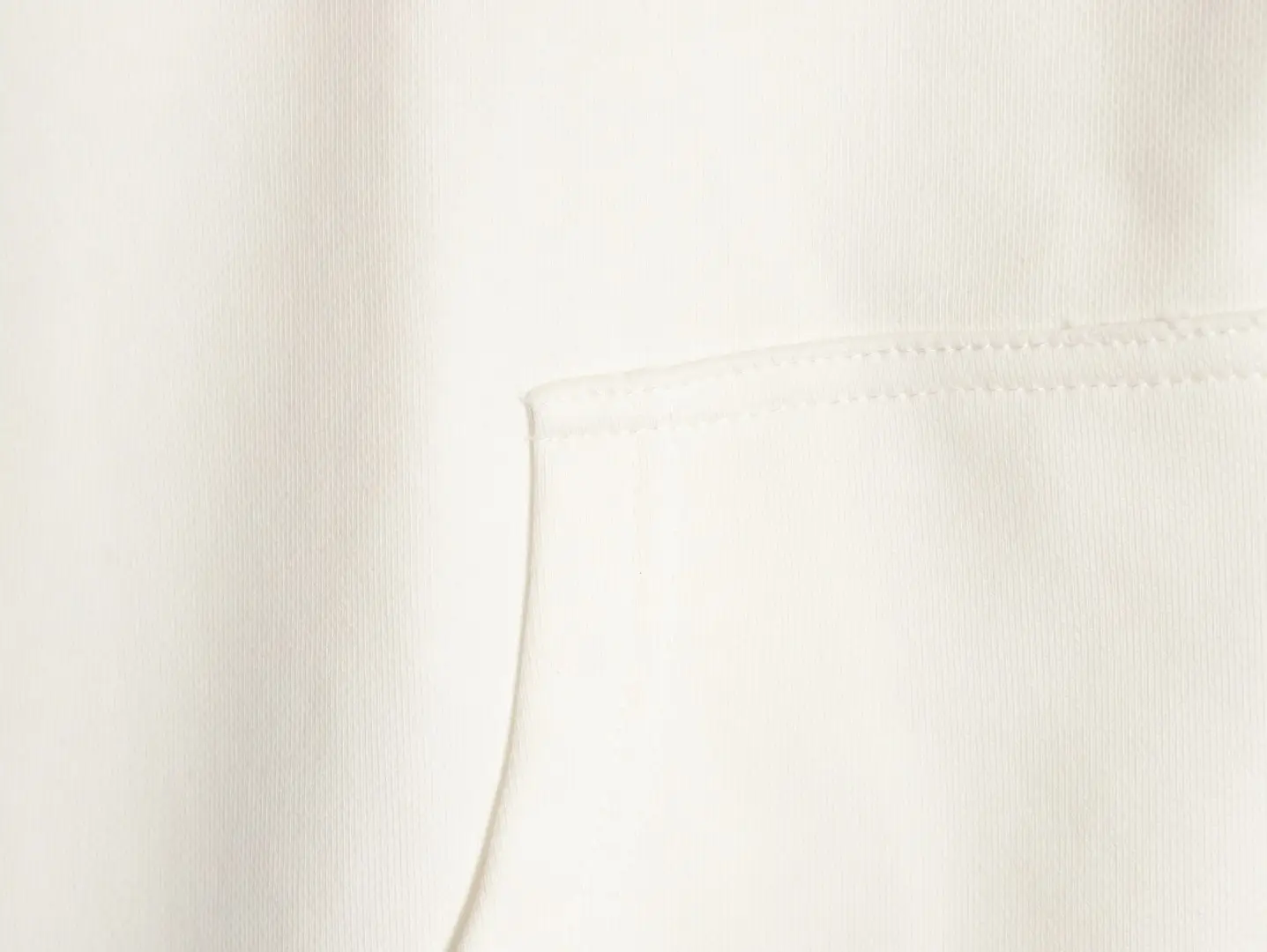 Repsgoat white cotton fabric close-up showing stitching and pocket detail