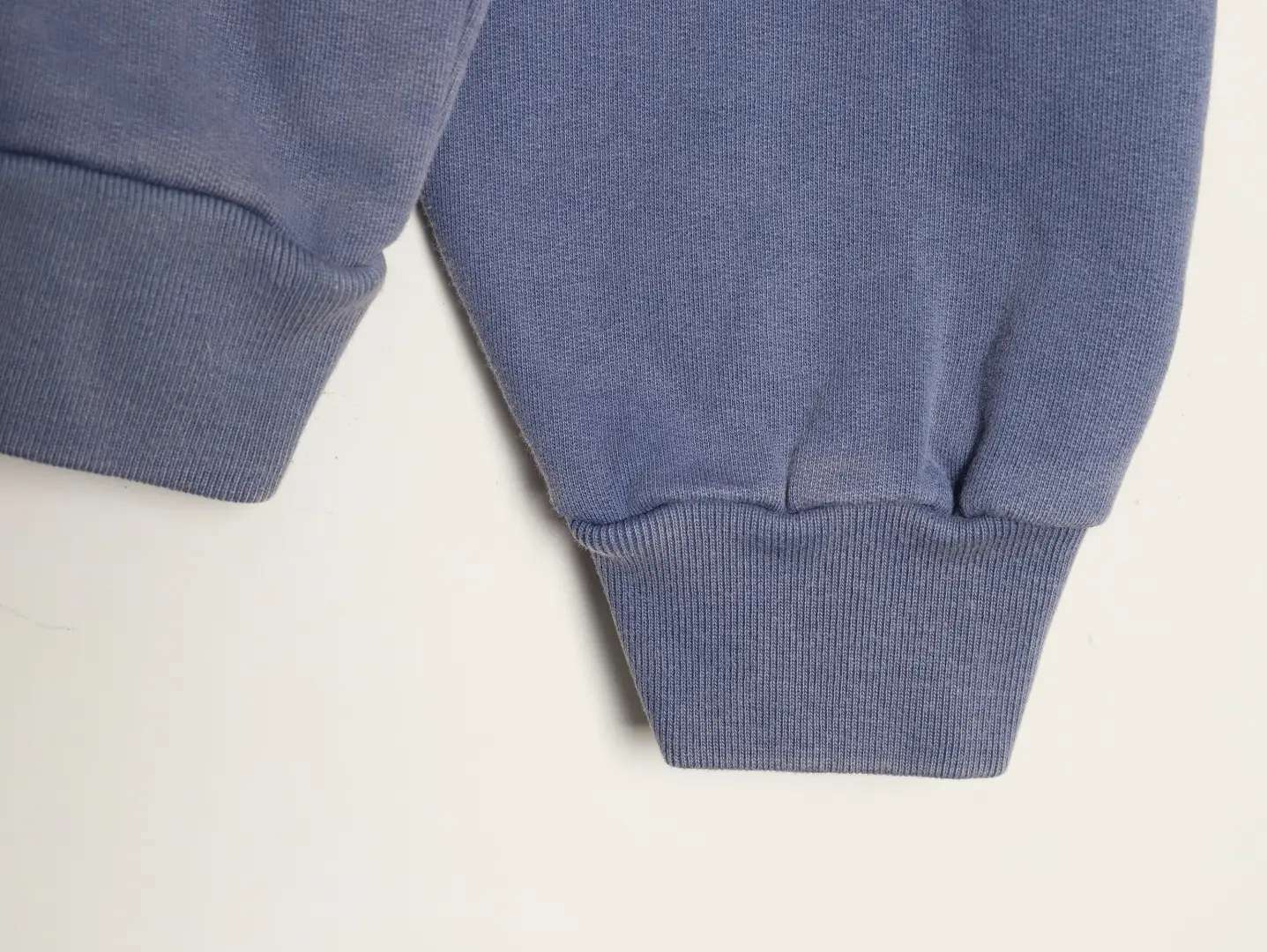 Repsgoat sweatshirt blue cotton fabric ribbed cuffs close-up view