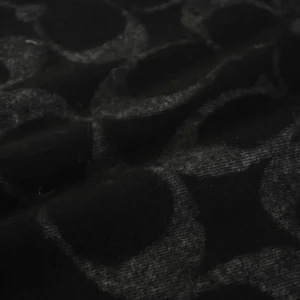 Coach scarf black wool fabric with signature C pattern texture close-up detail